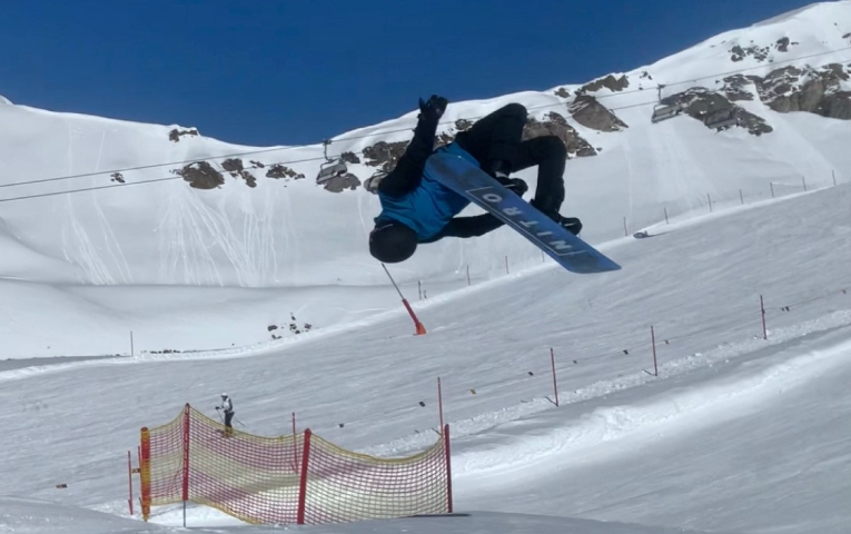 The author doing a backflip on a snowboard